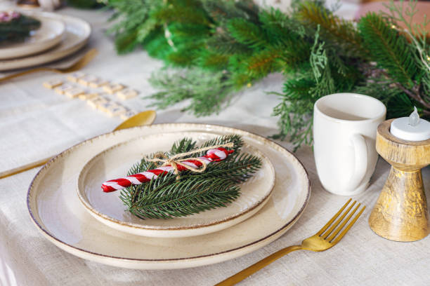 istock Festive table setting with natural decor for Chrismas dinner, winter holiday celebration 2187191222