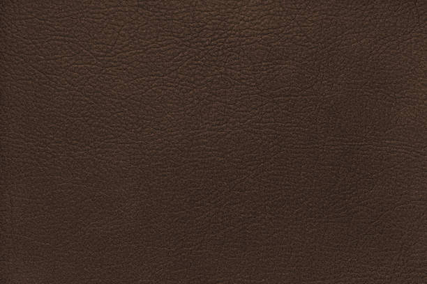 istock Natural, genuine solid brown leather texture, structure of matte leatherette macro background 2187191233