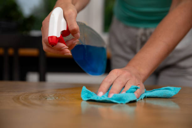 istock The process of cleaning a wooden surface using a spray and a cloth is quite effective 2187191690