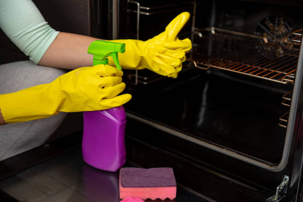 istock Clean your oven safely using appropriate products while wearing gloves for hygiene 2187191887