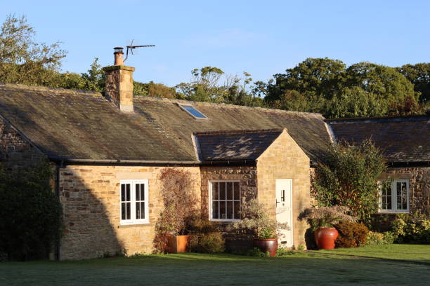 istock Stone cottage bathed in morning sunlight 2187193576