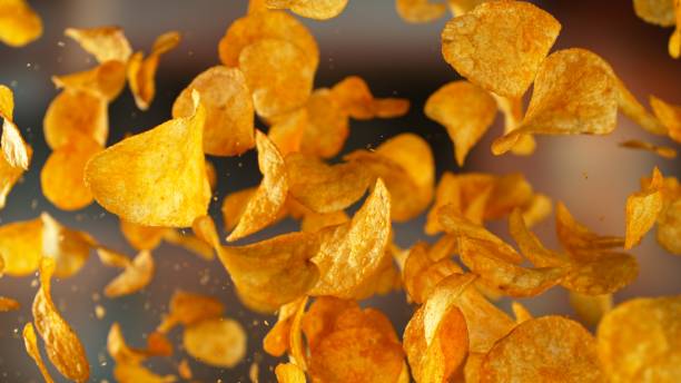 Freeze motion of flying fried potatoes chips