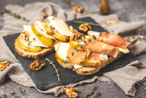 One tray with two delicious sandwiches on the table.