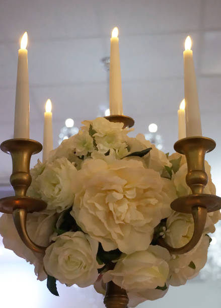 istock Decorative candlestick decorated with flowers in a wedding hall 2187195113