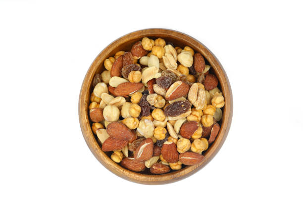 istock mixed nuts in bowl. Mix of various nuts on white background. 2187199131