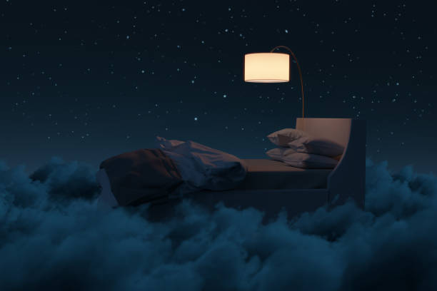 istock 3d rendering of cozy bed illuminated by lamp. The bed flying over fluffy clouds at night 2187201193