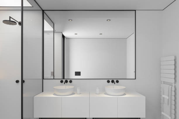 istock Minimalist Luxury Bathroom with White Walls and Dark Flooring 2187202924