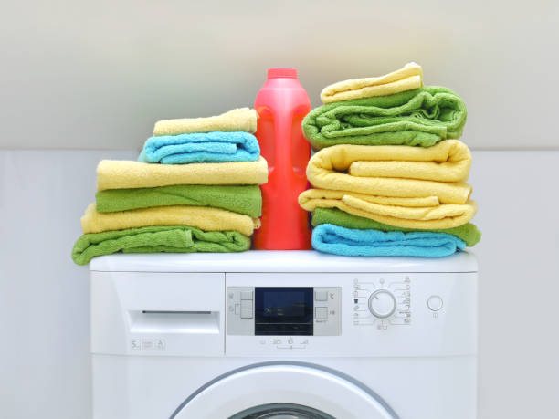 istock Colorful towels on washing machine 2187203020