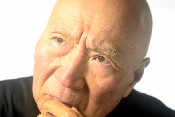 Close-up of an old man's troubled face