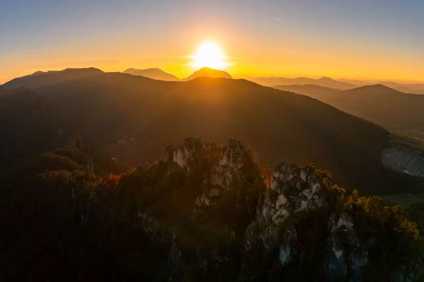 istock Sunrise over mountain range with golden sky 2187203258