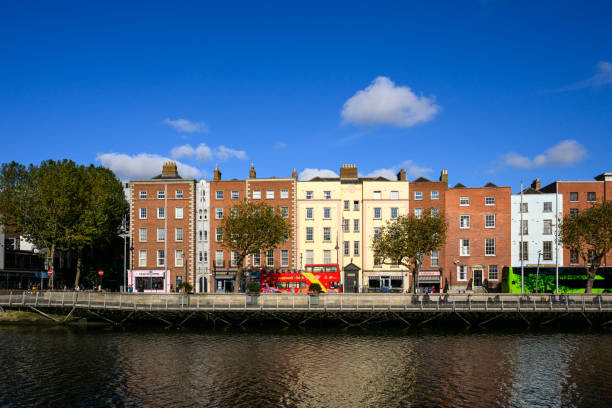 Dublin, Ireland - Oct 14, 2024:  Morning sun shines on the streets by the River Liffey.