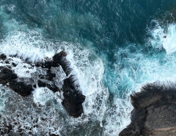 istock Atlantic ocean from above, waves and black basalt sand and rocks, view from a drone. 2187204607