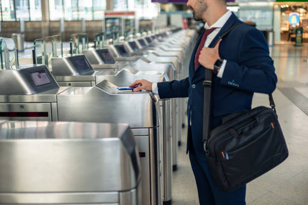 istock Unrecognizable businessman using contactless smartphone at metro barriers for work commute 2187204912