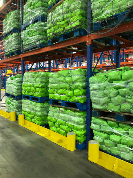 istock Pallets of potato sacks stacked in distribution center. 2187208269