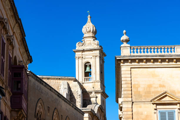 A picturesque view of the historic walled city of Mdina, Malta, featuring its iconic medieval architecture and tranquil surroundings.