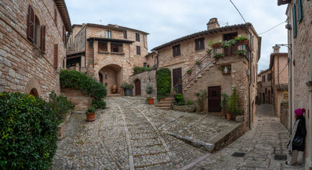Spello, Umbria, Italy: Spello is a village nestled on Mount Subasio. In the picture a characteristic little square while going down the alley of Via San Severino.