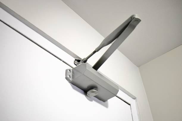 istock Automatic hydraulic door closer close up view 2187213300