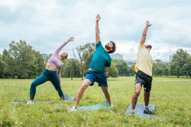 istock Diverse Group Engaging in Outdoor Yoga 2187215498