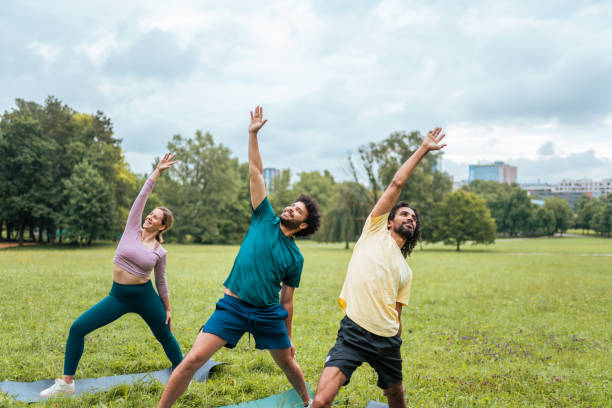 istock Outdoor Yoga Class with Diverse Participants and Instructor 2187215508