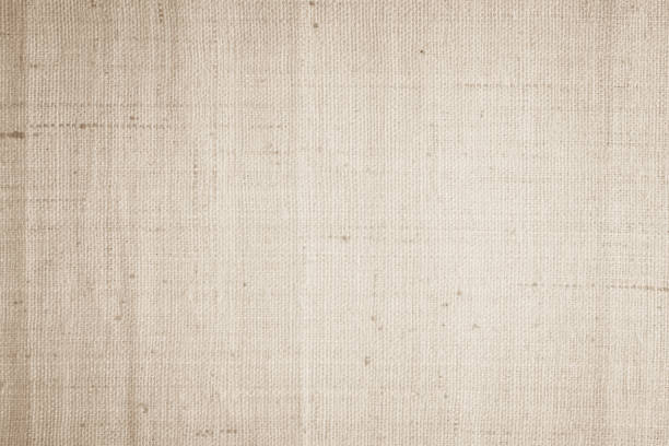 istock Brown sackcloth woven texture background in natural pattern. Jute hessian burlap, linen background in light beige cream color blank. Weaving canvas fiber line cotton cloth textured as organic. 2187215581