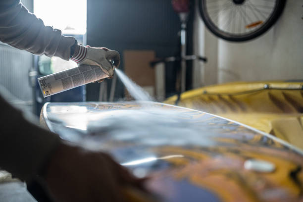 istock Surf Repair Shop. Craftsman Maintaining and Improving Surfboard 2187215588