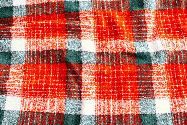 istock Colorful plaid pattern fabric showcasing vibrant red and white squares 2187215843