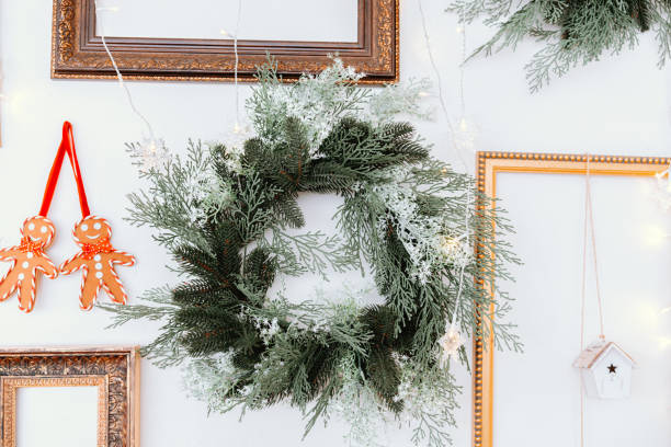 istock Decorative Christmas wreath with gingerbread ornaments on a wall display 2187215880