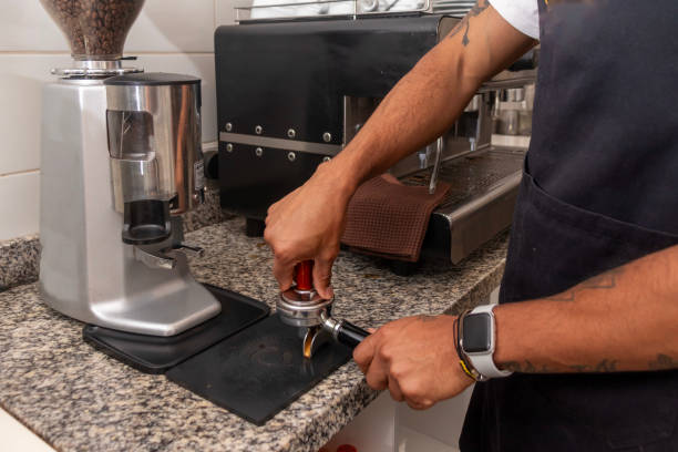 istock Barista pressing coffee in filter holder in coffee shop 2187219328