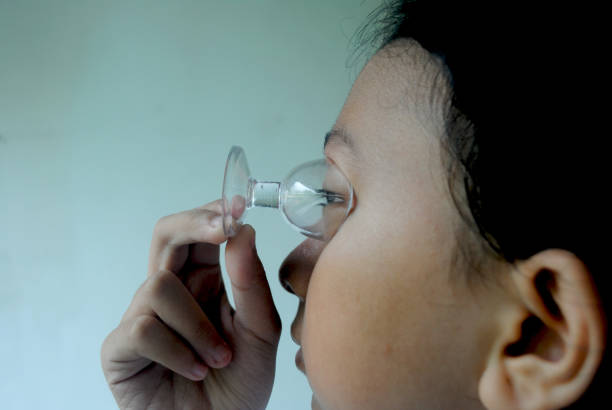 istock Person using a boor water glass.Eye treatment. 2187219504