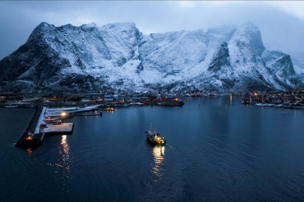 istock A beautiful and serene Arctic harbor, surrounded by stunning, snowcapped mountains 2187230321