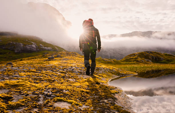 istock An Adventurous Hiker Embarking on a Journey to Explore a Scenic Mountainous Landscape 2187230611