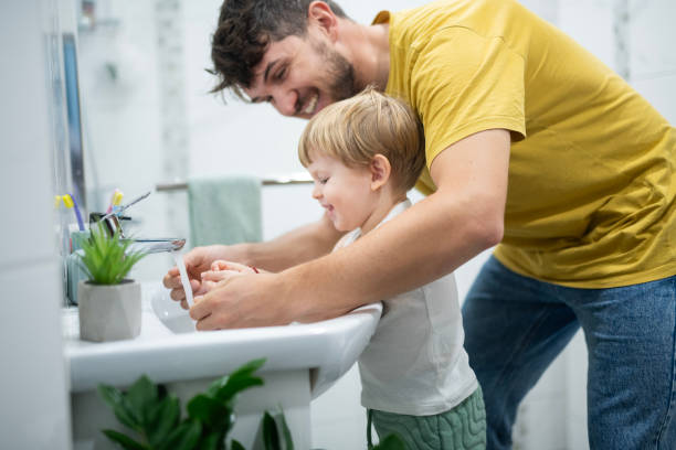 istock Teaching my little boy good hygiene habits. 2187237918