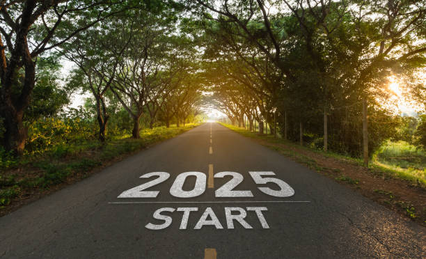 istock Inspirational Road Ahead for 2025 with Green Tree Canopy and Warm Sunlight, Symbolizing a Fresh Start and New Beginnings on a Journey 2187241976