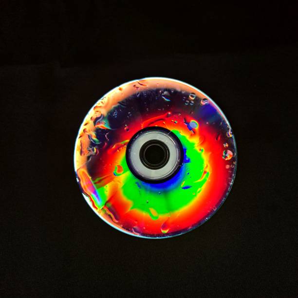 A striking artistic piece where vibrant discs are illuminated against a dark background, creating a dramatic and surreal contrast. The use of light and color enhances the visual impact, adding depth and intrigue to the composition.