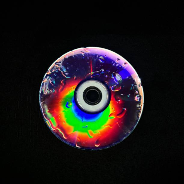 A striking artistic piece where vibrant discs are illuminated against a dark background, creating a dramatic and surreal contrast. The use of light and color enhances the visual impact, adding depth and intrigue to the composition.