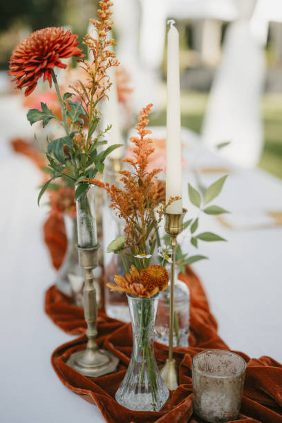 istock Romantic Backyard Wedding Table with Candles and Fall-Inspired Flowers 2187243281