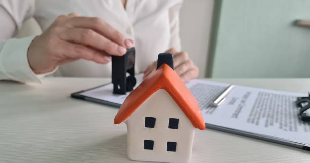 istock Documents deal with house with official seal 2187244637