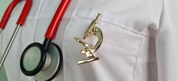 istock Doctor scientist biologist geneticist with stethoscope and microscope icon 2187245068