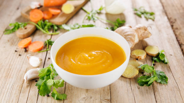 istock bowl of vegetable soup on wooden table 2187247096