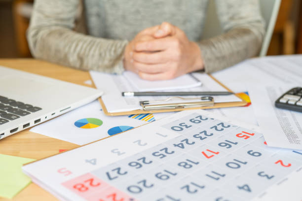 Professional Workspace With Calendar, Charts, And Laptop, Highlighting Time Management, Task Planning, Financial Organization, Productivity,Scheduling And Strategic Goals For Business Or Personal Use