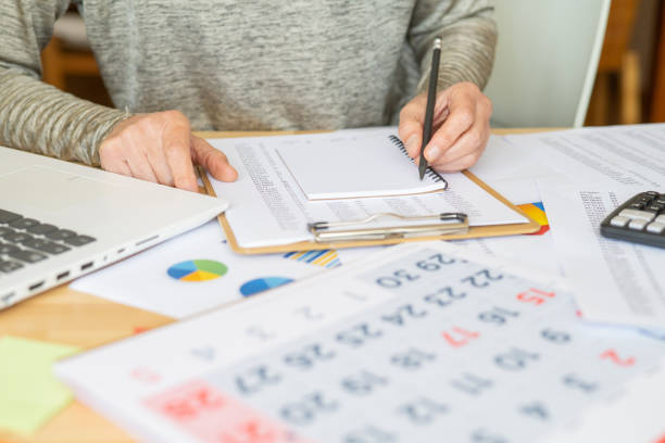 istock Writing Business Schedule, Planning, or Brainstorming Notes on Office Desk. Hand Preparing Project Plan, Corporate Strategy, and Company Tasks in Reminder, Ideas on Table. 2187248680