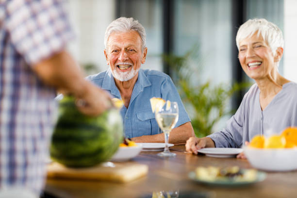 istock Happy seniors enjoying on social gathering. 2187249027