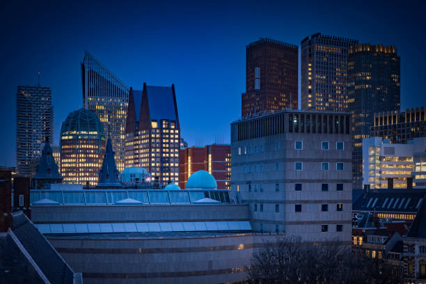 skyline with the modern office buildings in the centre of The Hague at dusk; The Hague, Netherlands