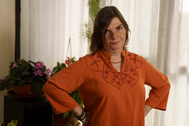 istock Confident Woman in Orange Blouse 2187250606