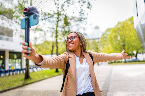 istock Content creator opening arms showing a city to the audience 2187252376