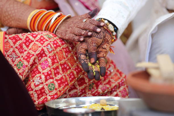 istock Offering prayers to the holy fire during a Hindu wedding ceremony. 2187252419
