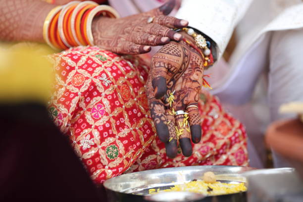 istock Offering prayers to the holy fire during a Hindu wedding ceremony. 2187252430