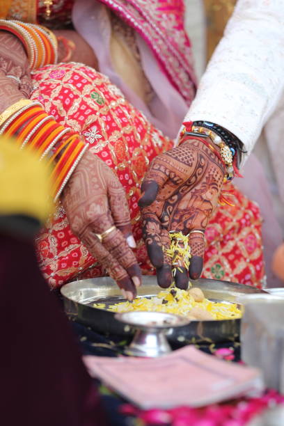 istock Offering prayers to the holy fire during a Hindu wedding ceremony. 2187252494