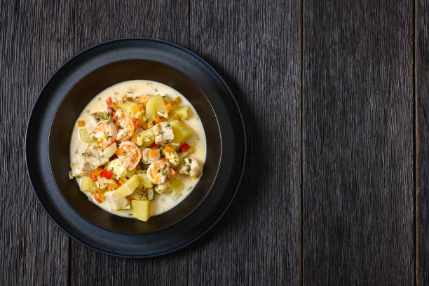 istock seafood chowder in a white bowl, top view 2187253171