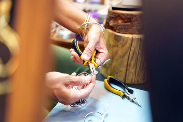 istock Jeweler creating handmade jewelry using pliers and wire 2187253209